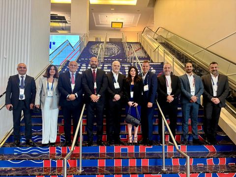 Delegation gathered on a staircase at SelectUSA