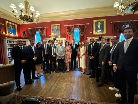 Large group photo in the red library room