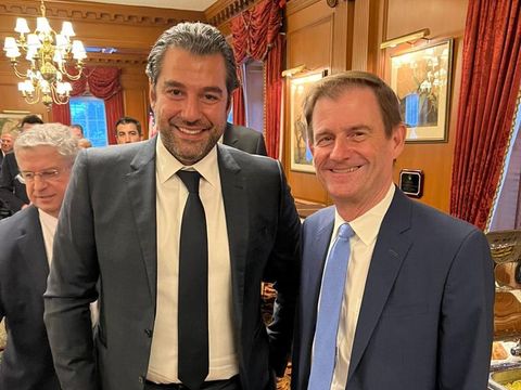 Two men posing at a reception